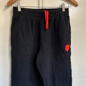 Nike Kids Black Joggers with Orange Accents
